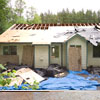 House Repair Edmonds, WA: BEFORE - Back Side of the House is destroyed by a fallen tree. Front Porch is damaged by falling tree branches. House is in need of a Roof Truss Repair, New Attic Insulation, New Drywall Inside, All Floor Coverings Must Be Re-done, Mold Must be abated throughout the house